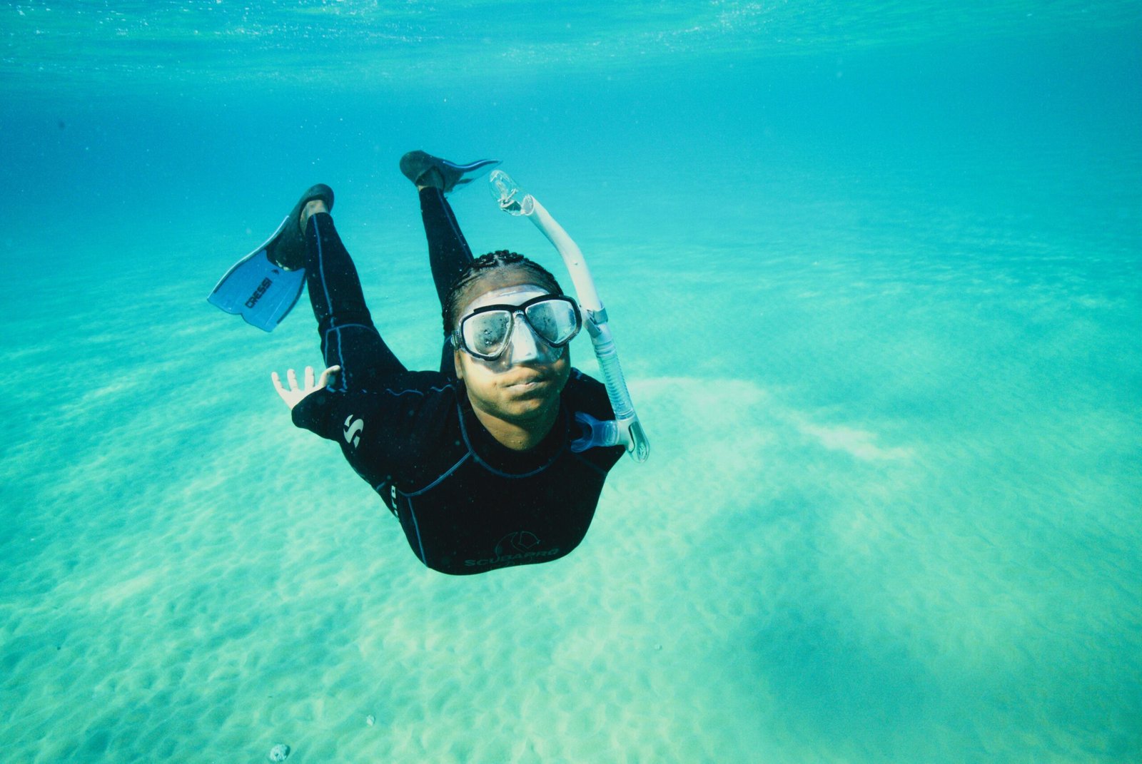 Snorkeler documenting coral restoration work